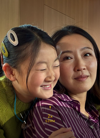 2x Telephoto feature in use, zooming in on mountain covered with trees and vegetation
