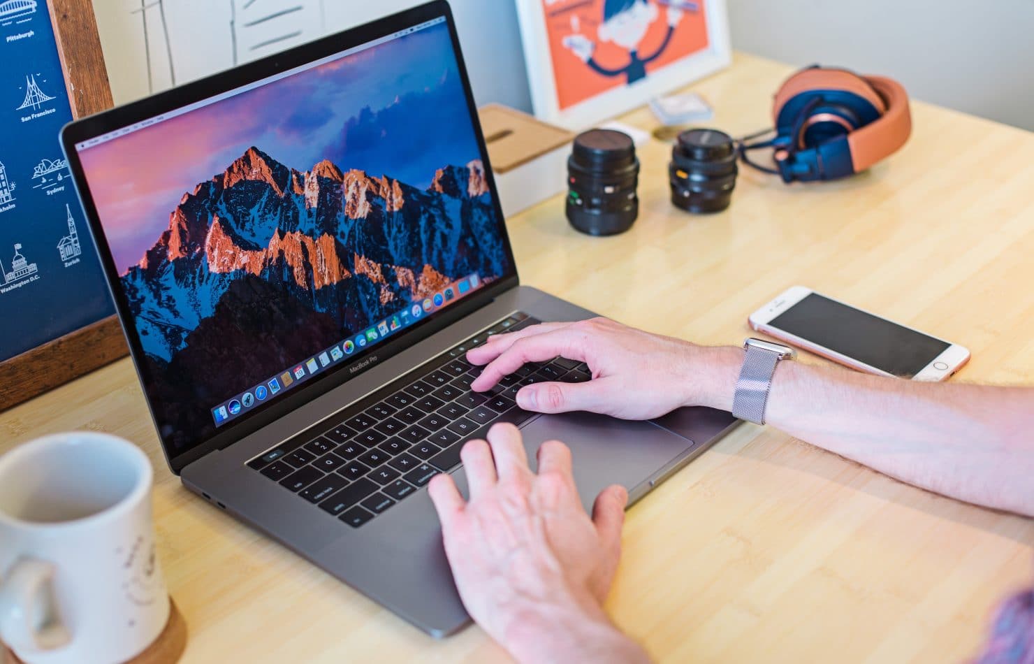 Man on MacBook with Cyber Security