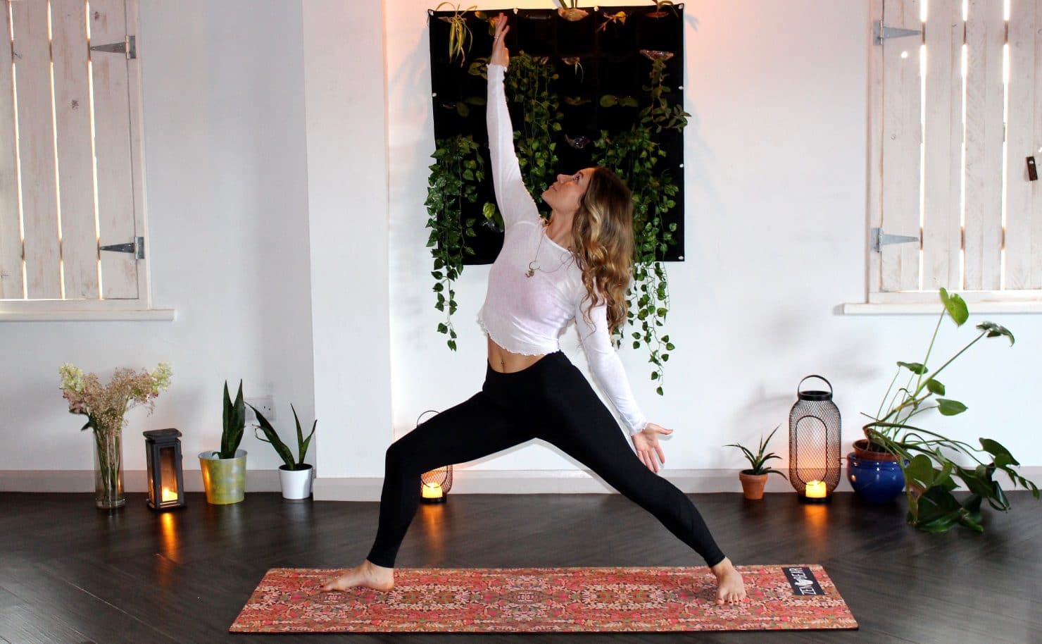 Woman doing yoga to her mindfulness apps