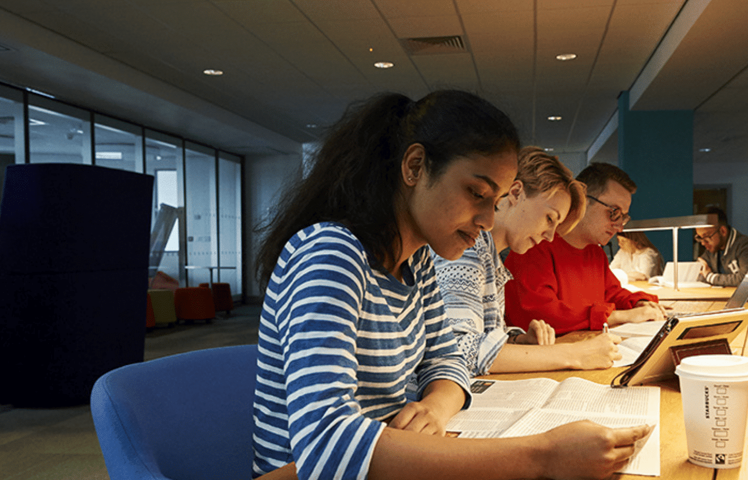 Students collaborating at a desk.