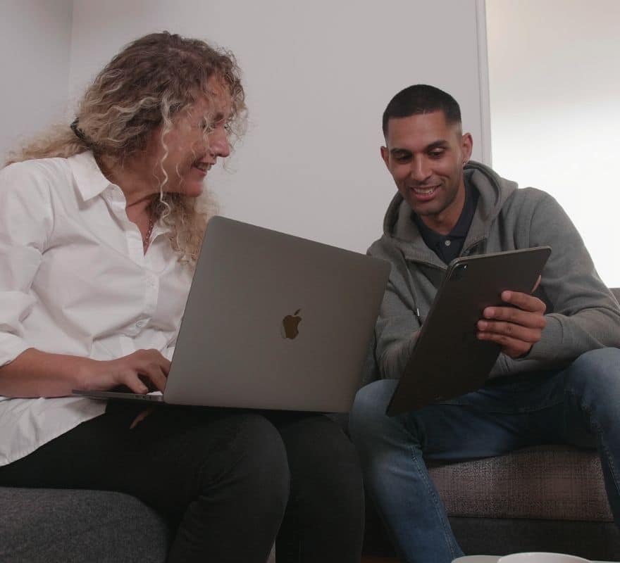 Colleagues using MacBook and iPad