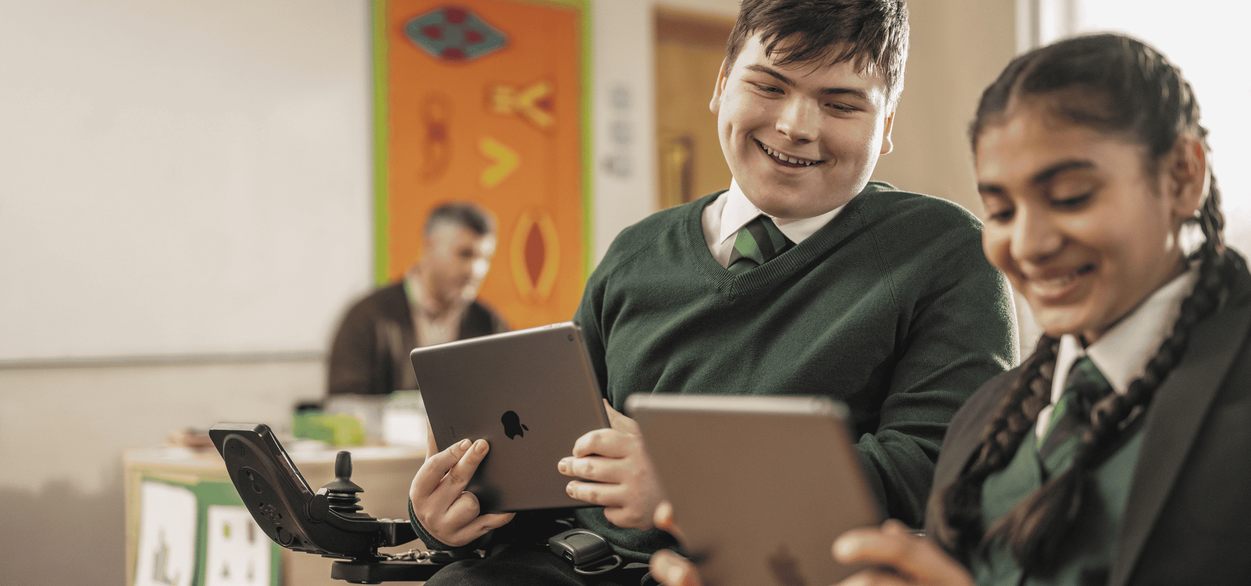 family fund - Student with mobility needs using iPad