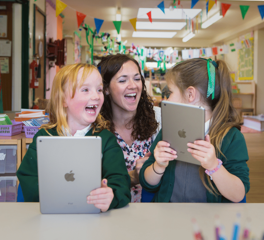 Teacher and student happy using iPad