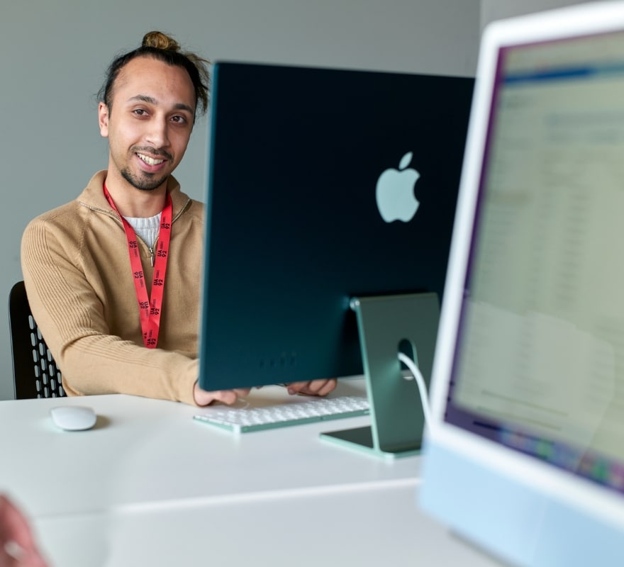 A man working on an iMac