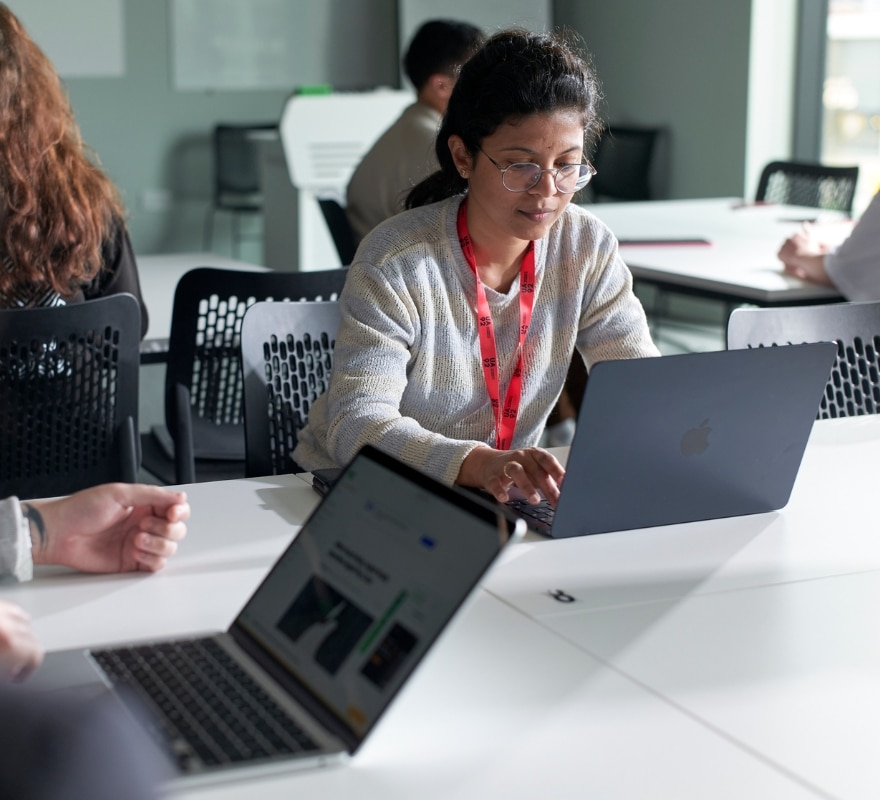 Woman working on a MacBook