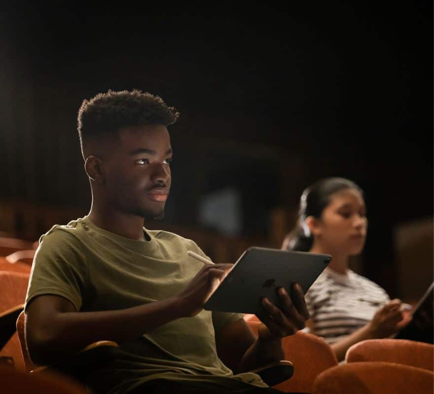 Students using iPad in a lecture hall