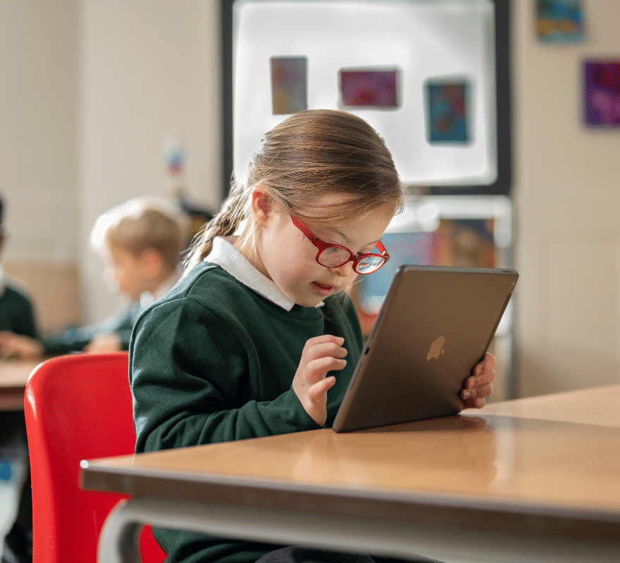 SEND student with glasses using iPad