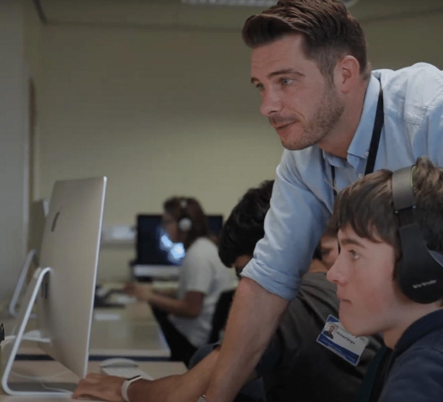 Student and teacher using Apple technology together